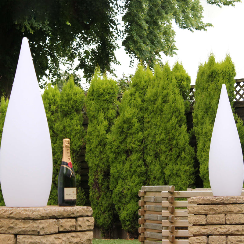 Two waterdrop lamps on a pillar, in the garden